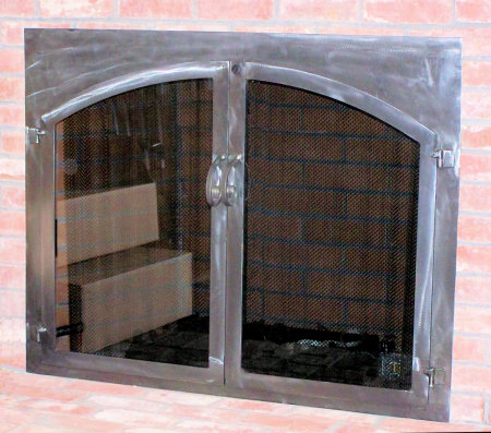 Chatham square to arch in all natural iron finish with twin doors standard smoked glass slide mesh spark screen